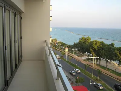 a balcony of a building with a view of the ocean at Seaview Limassol Apartment 602 by Ezoria Villas in Limassol