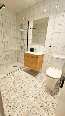 a bathroom with a toilet and a shower and a sink at The Colors of Larnaca in Larnaka