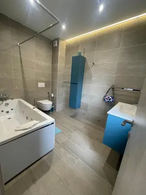 a bathroom with a tub and a sink and a toilet at Mountain Villa in Prodromos with Fireplace & Sauna in Prodromos