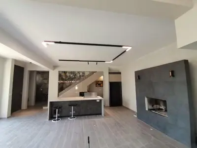 a living room with a fireplace in the middle at Mountain Villa in Prodromos with Fireplace & Sauna in Prodromos