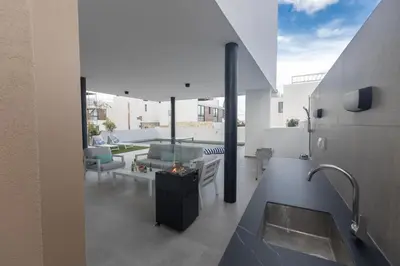 a kitchen and living room of a house at Aqua 4 Bedrooms in Paralimni