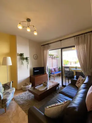 a living room with a couch and a table at Kition Cozy Residence in Larnaka