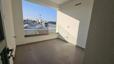 an empty room with a view of a balcony at STAY Larnaca Pearl Apartment in Larnaka
