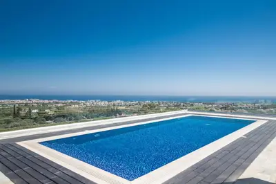 a swimming pool on the roof of a house at Villa Marilia in Protaras