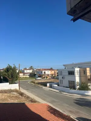 an empty street in a city with buildings at Tranquil paradise in Larnaka