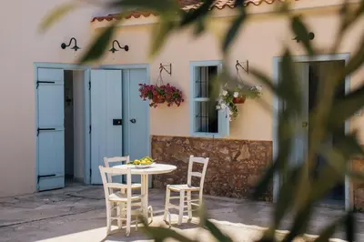 a table and chairs in front of a building at Siogkas Inn in Dherinia