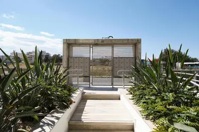 a building with some plants in front of it at Suite 1003 at Althea Residence in Larnaka