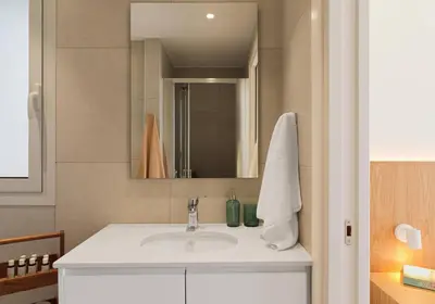 a bathroom with a sink and a mirror at Suite 1003 at Althea Residence in Larnaka