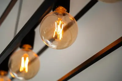 two light bulbs are hanging from a ceiling at Central Luxurious 2 bedroom flat in Strovolos
