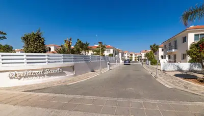 a street in a villa with a fence at Mythical Sands Apartment BA09 in Protaras