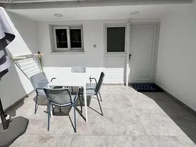 a dining room with a table and chairs at STAY Napa Ocean Apartment in Ayia Napa