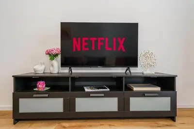 a entertainment center with a television on top of it at Cozy Apartment in Kapparis # 506 in Paralimni