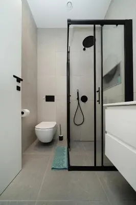a bathroom with a glass shower and a toilet at Luxury Studio in the Heart of Limassol in Limassol