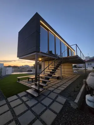 a modern house with glassdoors and stairs on a building at Mi Filoxenia 1 in Aglantzia