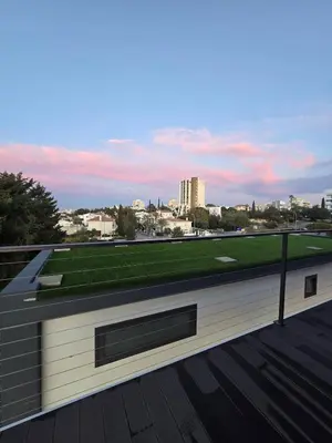 a building with a roof with green grass on it at Mi Filoxenia 1 in Aglantzia