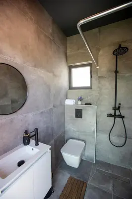 a bathroom with a sink and a toilet and a shower at Mi Filoxenia 1 in Aglantzia