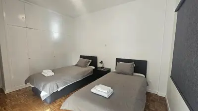 two beds sitting next to each other in a room at STAY Hydra Comfort Apartment in Nicosia