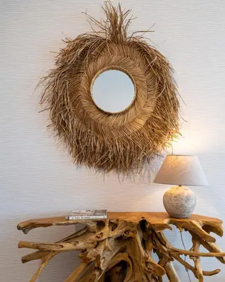 a mirror on a wall next to a table with a lamp at Aelia - Chic 2-BR Apartment & Balcony in Larnaca in Larnaka