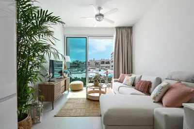 a living room with a couch and a ceiling fan at Crystal Coast in Protaras
