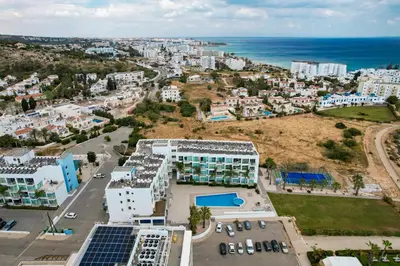 an aerial view of a city and the ocean at Crystal Coast in Protaras