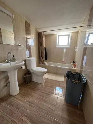 a bathroom with a sink and a toilet and a tub at Huge Terrace in peaceful Oroklini in Voroklini