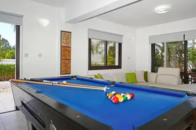 a pool table in a living room with a pool table at Villa GreenWay - Large Private Pool in Protaras