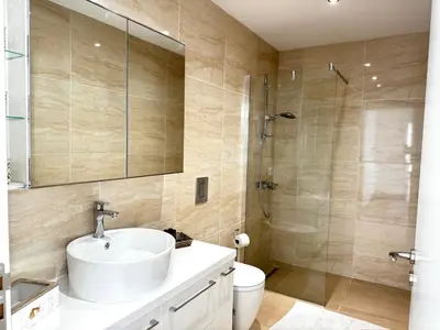 a bathroom with a sink and a shower at Wealthystays Duplex in the Heart of Nicosia in Nicosia