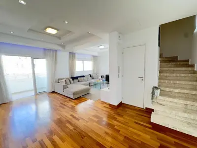 a living room with a couch and a staircase at Wealthystays Duplex in the Heart of Nicosia in Nicosia