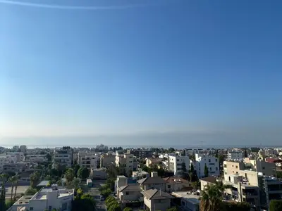 a view of a city with houses and the ocean at Gorgeous 1 Bedroom apartment close to Town Centre in Limassol