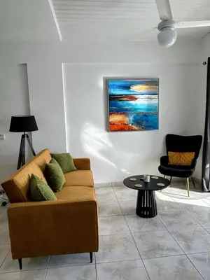 a living room with a couch and a table at Casa Sea Breeze in Larnaka