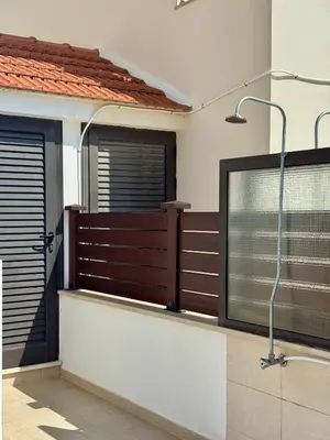 a bathroom with a shower and a glass door at Lazuli Zen Villa with Private Pool in Pyla