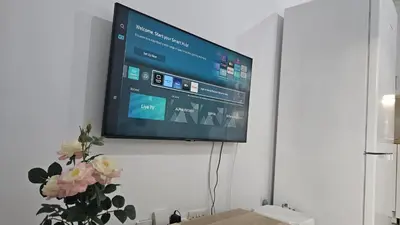 a flat screen tv hanging on a wall at STAY Historia Apartment in Nicosia