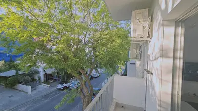 a view of a tree from the balcony of a house at STAY Historia Apartment in Nicosia