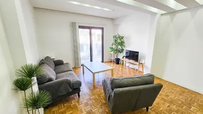 a living room with a couch and a table at The Cozy Seaside Retreat in Larnaka