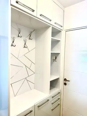 a walk in closet with white cabinets and a door at Central Napa Escape - Adults Only in Ayia Napa