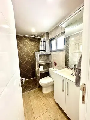 a bathroom with a toilet and a sink at Central Napa Escape - Adults Only in Ayia Napa