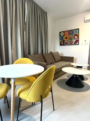 a living room with two tables and a couch at Verasia Acute Stay in Engomi in Engomi