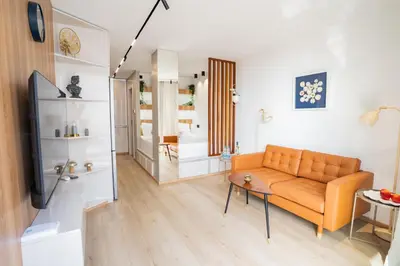 a living room with a couch and a table at SuiteNapa22 in Ayia Napa