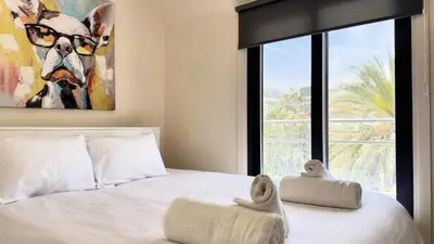 a bedroom with a bed with two towels on it at City Centre 2-Bedroom, Old Town, Nicosia in Nicosia