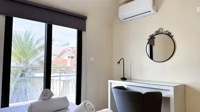a living room with a fireplace and a mirror at City Centre 2-Bedroom, Old Town, Nicosia in Nicosia