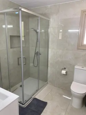 a shower stall in a bathroom with a toilet at Mimosa 18 Beachhouse Villa in Protaras