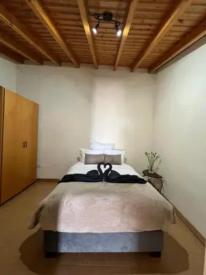 a bedroom with a large bed in a room at Odou Off-grid in Odhou