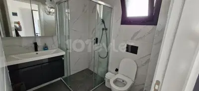 a bathroom with a shower and a toilet and a sink at CEASAR RESORT STUDIO Consus in Aglantzia