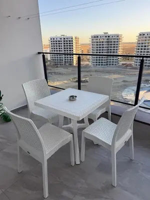 a white table and chairs on a balcony with a view at CEASAR RESORT STUDIO Consus in Aglantzia