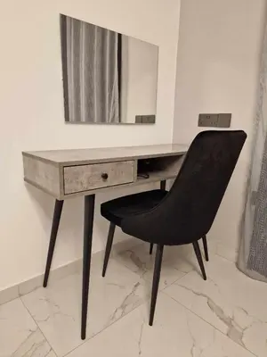 a desk with a mirror and a black chair at Modern House in Touristic Pyla - Oroklini! in Larnaka