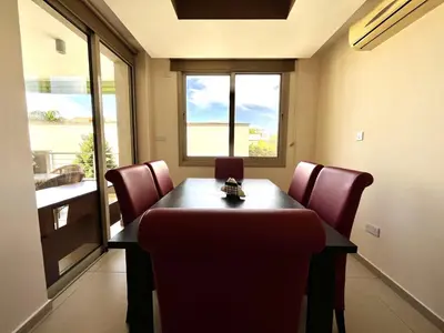 a conference room with a table and chairs and a window at STAY Mesa Luxe Apartment in Limassol