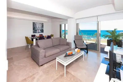 a living room with a couch and a table at Apartment Marina - Beachfront in Protaras