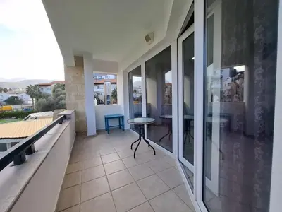 a balcony of a house with a table on it at At Patara Site, the heart of Kyrenia in Aglantzia