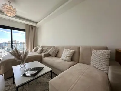 a living room with a couch and a table at Marcellus in Larnaka