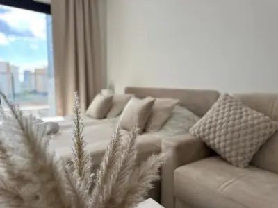 a living room with a couch and a christmas tree at Marcellus in Larnaka